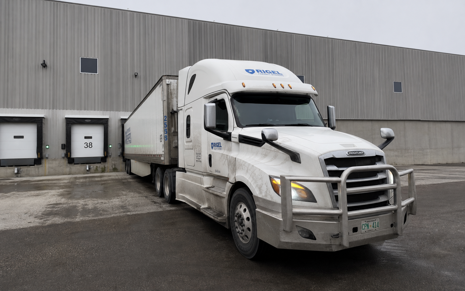 Rigel Freight Systems tractor trailer at a loading dock